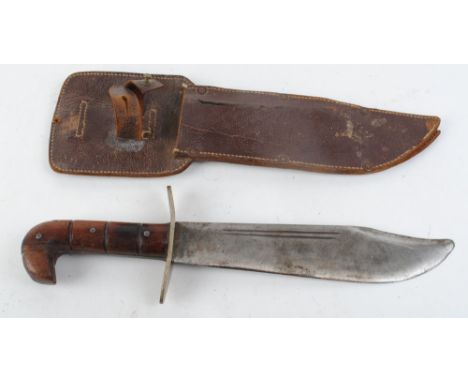 Large bowie type hunting knife, 9,1/2 ins narrow fullered blade, white metal cross guard, wood grips, in leather sheath