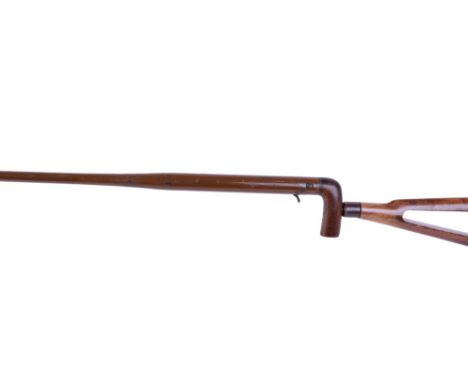 28 bore Walking Stick shotgun, brown painted, slide safety, wood handle stamped F T Baker. 88 Fleet St. London, detachable sk