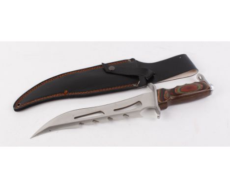 Large presentation hunting knife, 10,1/2 ins curved pierced and saw backed blade, coloured wood grips, in leatherette sheath