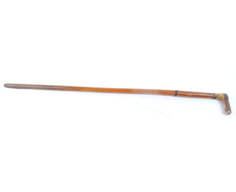 9mm Walking stick cane covered shotgun with button trigger and horn handle. The Purchaser of this Lot requires either a Secti