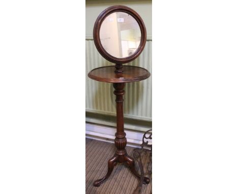 A late Victorian mahogany shaving mirror on tripod stand