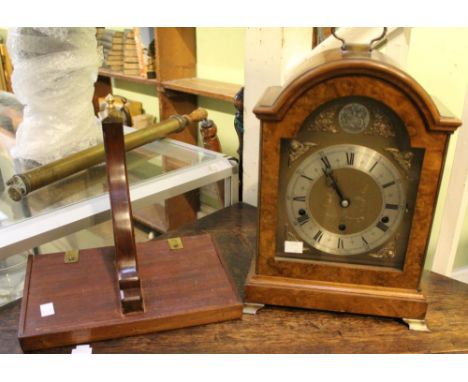 An Elliott Georgian design walnut cased bracket clock, having an 8-day lever, Westminster / Whittington chime, arched brass d