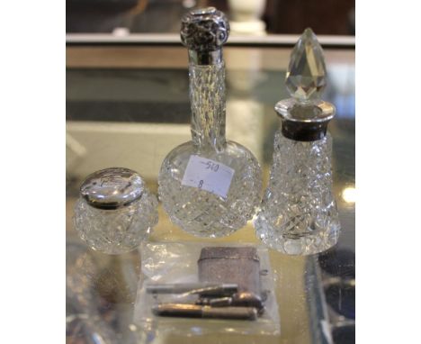 A quantity of silver and silver mounted glass items, comprising a vesta, scent bottles, tooth pick and a miniature steel scre