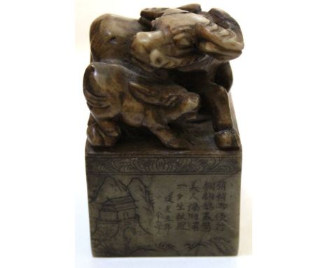 A Chinese stoneware chop/seal for year of the Ox with carved buffalo &amp; calf