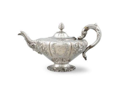 AN IRISH SILVER VICTORIAN TEAPOT, Dublin, c.1844, mark of James Moore, of melon form, the cover with pineapple finial, and th