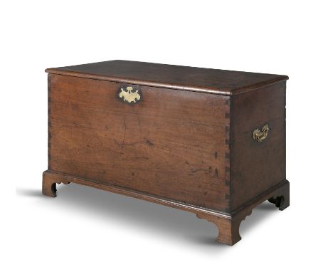 AN IRISH GEORGE III MAHOGANY BLANKET CHEST, with hinged panel top fitted with brass escutcheons and side handles on bracket f