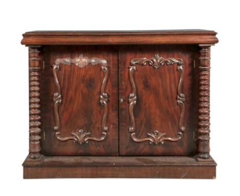 A VICTORIAN MAHOGANY SIDE CABINET, of rectangular form, with solid panel top and twin cupboard doors, overlaid with scrollwor