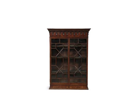A 19TH CENTURY UPRIGHT WALL CABINET, with decorative moulded cornice above a single astragal glazed panel door on a moulded b