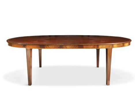 A FINE GEORGIAN REVIVAL MAHOGANY OVAL DINING TABLE, the solid panel top with satinwood banding and reeded edge, on channelled