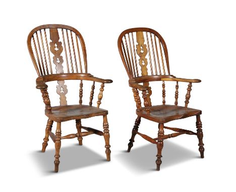 A PAIR OF 19TH CENTURY OAK AND BEECHWOOD WINDSOR CHAIRS, the arched backs with pierced splat and eight bar supports over a so