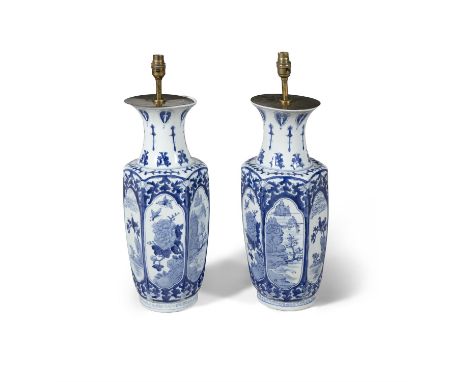 A PAIR OF MODERN BLUE AND WHITE VASES CONVERTED TO LAMPS, of baluster form, the hexagonal body with landscape depictions to e