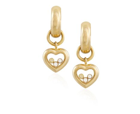 A PAIR OF 'HAPPY DIAMOND' EARRINGS, BY CHOPARD, each glazed heart-shaped compartment with three collet-set 'floating' diamond