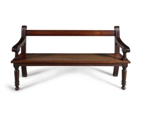 A VICTORIAN MAHOGANY HALL BENCH, c.1860, with reeded back rail and armrests, solid panel seat and ring-turned tapering legs. 
