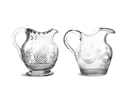 AN IRISH GEORGE III CUT GLASS WATER PITCHER, applied with clear scroll handle, wavy rim, and body set with interspersed stars