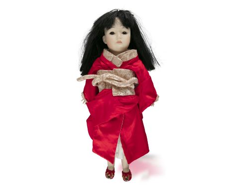 A SIMON AND HALBIG BISQUE HEAD PORCELAIN DOLL, 1829 series of a Chinese girl in red overcoat, incised factory mark to rear of