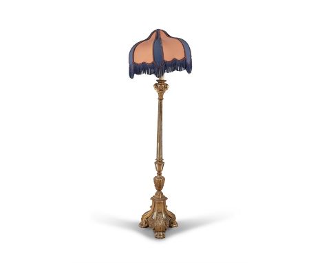 AN ITALIAN GILTWOOD TORCHERE CONVERTED TO STANDARD LAMP, of renaissance design, fitted with peach and navy shade