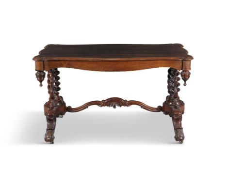 A VICTORIAN MAHOGANY CENTRE TABLE, c.1870, of serpentine outline, the moulded panel top on twin spiral turned support columns