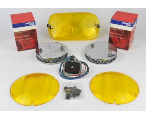 Collection of parts and lucas light covers - to include Two Unipart under bumper rear fog warning lamps (boxed), Two pancake 