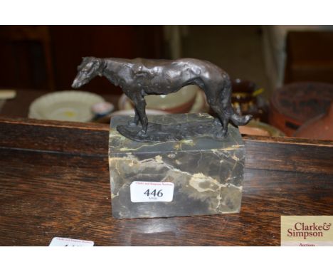 A bronze abstract study of a dog raised on marble base