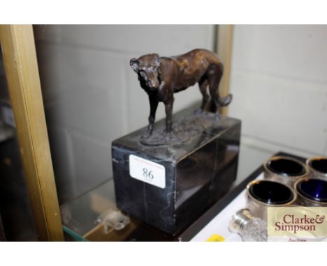 A small bronze abstract study of a dog on marble base