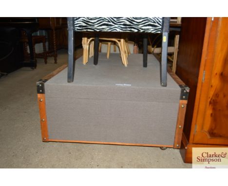 A coffee table in the form of a large vintage style trunk