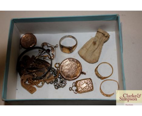 A box containing various yellow metal items to include 18ct gold ring, 9ct gold cross pendant, 9ct gold locket; and small bag