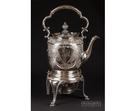 A silver plated spirit kettle, hinged on a tripod base with burner, 35 cm high max.