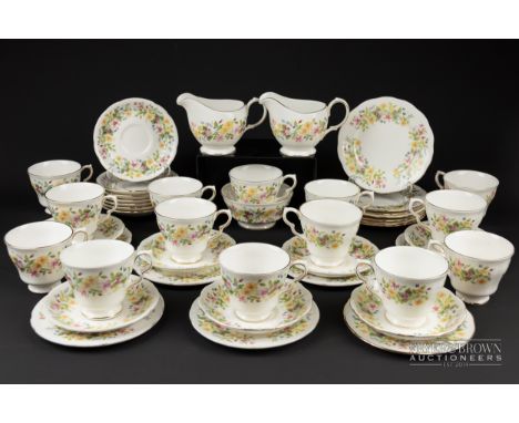A Colclough bone china part tea service, 'Hedgerow' pattern, comprising fourteen cups &amp; saucers, two milk jugs, a sugar b