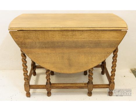 A light oak gate-leg table, c1920, 105 x 55 x 71cm closed