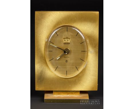 A Jaeger recital gilded alarm desk clock, c1966, the oval burnished gilt dial with black enamel baton numerals, with separate