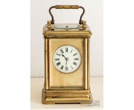 A good antique repeater carriage clock, c1890, the lacquered gilded brass corniche case with a circular cream enamel dial wit