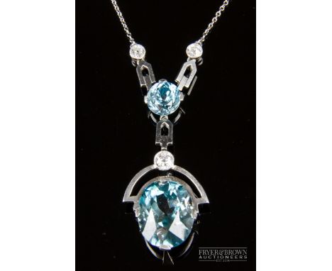 An attractive Art Deco platinum blue zircon and diamond pendant, c1920, set with collet milgrain set old brilliant cut diamon