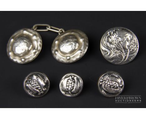 Three Liberty &amp; Co. Cymric circular silver buttons with stylised pomegranates, makers mark L &amp; Co., Birmingham 1899; 