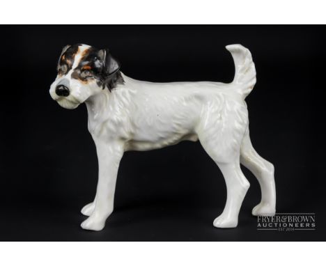 A Royal Crown Derby porcelain figure of a terrier, brown patch ears, 10cm high max. approx.