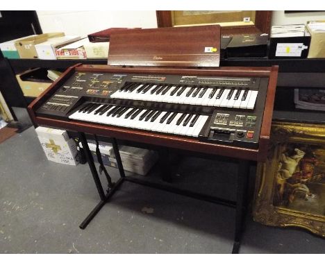 An Electone electronic twin keyboard on stand with pedals and separate speaker cabinet (qty)