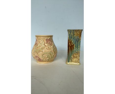 Wade Heath "Gothic" pottery vase, England, features an embossed floral design. Includes a glazed art pottery bud vase in blue