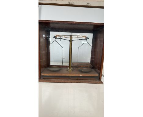 Brass and wood balance scale in glazed mahogany case, complete with original boxed set of precision weights from the 19th cen
