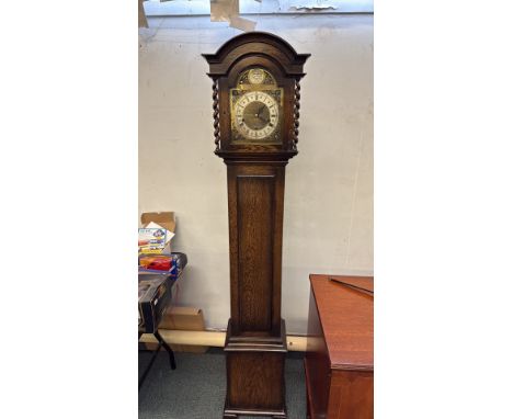 Oak-cased longcase clock with barley twist columns, brass Tempus Fugit dial, and Roman numeral face. Marked "J.W. Turner, Bla