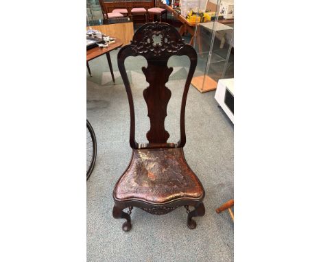 19th-century Chippendale-style chair with ornate carved mahogany frame and embossed leather seat. Features cabriole legs with