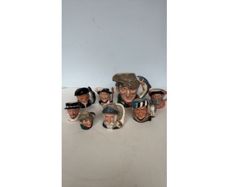 Royal Doulton character jug collection, featuring "The Poacher" D6429 (1954) and others. Hand-painted ceramic, finely detaile