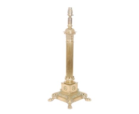 A late 19th Century brass Corinthian column table lamp on a square base applied with acanthus leaf mounts and paw feet, heigh