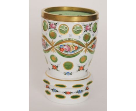 A 20th Century Czechoslovakian glass beaker in the 19th Century Bohemian taste of footed barrel form, cased in opal over pale