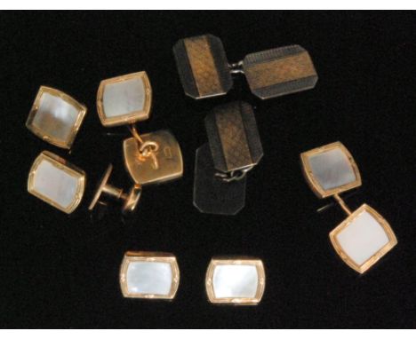 A set of four 9ct and mother of pearl gentleman's dress set comprising of four buttons, a pair of cufflinks and a stud, each 