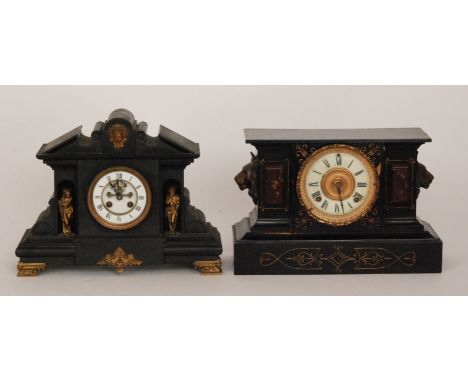 A Victorian slate mantle clock with lion masks to the side together with a similar slate mantle clock, width 39cm