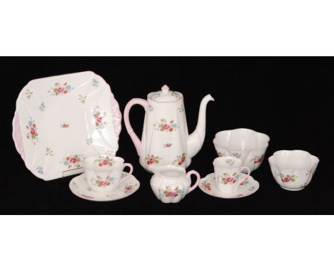 A 1920s Shelley Dainty shape Rose and Red Daisy pattern tea and coffee set comprising teapot, twelve cups, saucers and side p