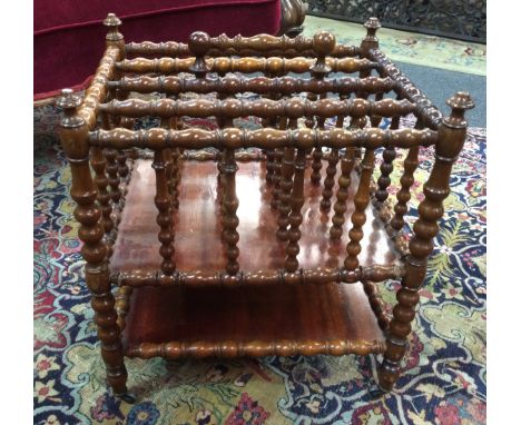 A Victorian bobbin-turned walnut four-division Canterbury, with stretcher shelf below, S/D, height 47cm and width 42cm. 