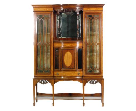 An early 20th Century foliate inlaid mahogany salon side cabinet, the cornice pediment over a central mirror backed alcove wi