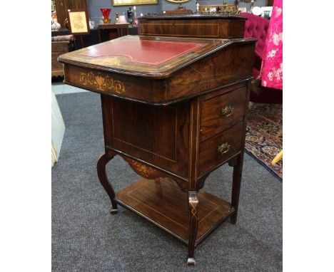 A late 19th to early 20th Century rosewood Davenport desk, the galleried top over the hinged writing surface, further fitted 