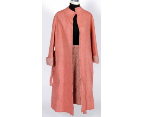 A 1960s Christian Diorling, London, wool hounds tooth double faced coat and matching skirt, the red oversized collarless coat