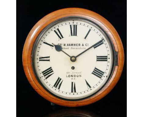 An early 20th Century circular mahogany wall clock with single fusee movement, the dial signed 'George M Hammer & Co School F